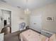 This charming bedroom features a chandelier, closet, and carpeted flooring at 3805 Mammoth Grove Rd, Lake Wales, FL 33898