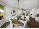 Dining area and kitchen offer a seamless flow and lovely views of the outdoors at 3805 Mammoth Grove Rd, Lake Wales, FL 33898