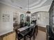 Elegant dining room with wood floors, decorative lighting, and detailed ceiling at 3805 Mammoth Grove Rd, Lake Wales, FL 33898