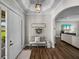 Foyer with hardwood floors, decor accents, and sight lines into the living room at 3805 Mammoth Grove Rd, Lake Wales, FL 33898
