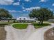 Charming home nestled on expansive grounds, highlighted by mature trees and a sweeping circular driveway at 3805 Mammoth Grove Rd, Lake Wales, FL 33898