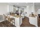 Bright kitchen features white cabinets, granite countertops and a large island with seating at 3805 Mammoth Grove Rd, Lake Wales, FL 33898