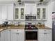 Stylish kitchen with white cabinets, granite countertops, and stainless steel microwave and oven at 3805 Mammoth Grove Rd, Lake Wales, FL 33898