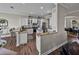 Bright kitchen with white cabinets, granite countertops, and wood floors at 3805 Mammoth Grove Rd, Lake Wales, FL 33898