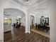 Open-concept living space featuring beautiful hardwood floors, dining and living areas at 3805 Mammoth Grove Rd, Lake Wales, FL 33898
