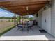 Covered porch, bar, outdoor seating and TV make for the perfect outdoor space at 3805 Mammoth Grove Rd, Lake Wales, FL 33898