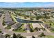 An aerial view of a home in a pond-side community, with manicured lawns at 3844 Bedford Ave, Winter Haven, FL 33884
