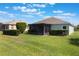 Expansive backyard with a screened-in porch and lush green lawn at 3844 Bedford Ave, Winter Haven, FL 33884