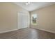 Bedroom with wood-look floors, ceiling fan and closet at 3844 Bedford Ave, Winter Haven, FL 33884