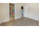 Bright bedroom with wood-look flooring and an ensuite bathroom at 3844 Bedford Ave, Winter Haven, FL 33884