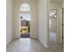 Bright foyer with tile flooring, arched window, and a clear view of the home's exterior at 3844 Bedford Ave, Winter Haven, FL 33884