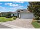 Charming home with paver driveway, well-manicured landscaping, and a two-car garage at 3844 Bedford Ave, Winter Haven, FL 33884