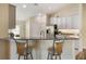 Kitchen featuring granite countertops, barstool seating, and stainless steel appliances, perfect for entertaining at 3844 Bedford Ave, Winter Haven, FL 33884