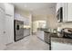 Modern kitchen with stainless steel appliances, granite countertops, and ample cabinet space, ready for cooking at 3844 Bedford Ave, Winter Haven, FL 33884