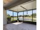 Screened lanai with views of a beautiful pond and fountain at 3844 Bedford Ave, Winter Haven, FL 33884