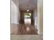 Spacious living room with hardwood floors, ceiling fan, and sliding glass doors leading to the outdoors at 3844 Bedford Ave, Winter Haven, FL 33884