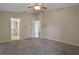 Main bedroom features ceiling fan and entry to ensuite bathroom at 3844 Bedford Ave, Winter Haven, FL 33884
