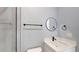 Modern bathroom with a single vanity, a white countertop, and black fixtures at 404 Miami Way, Kissimmee, FL 34759