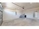 Spacious two-car garage with concrete flooring, white walls, and ample storage space at 404 Miami Way, Kissimmee, FL 34759