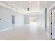 Bright and airy living room with neutral walls, tile floors, recessed lights and a ceiling fan at 404 Miami Way, Kissimmee, FL 34759