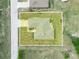 Aerial view of the property highlighting the house layout and surrounding yard space at 409 N 6Th St, Lake Hamilton, FL 33851