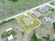 Aerial view of the house, showing the neighborhood and outlining the property at 409 N 6Th St, Lake Hamilton, FL 33851