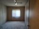 Comfortable bedroom with neutral carpet, a ceiling fan, and ample natural light at 418 Tivoli Park Dr, Davenport, FL 33897