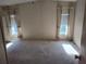 Bright bedroom featuring two windows, neutral carpet, and lots of natural light at 418 Tivoli Park Dr, Davenport, FL 33897