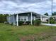 Charming single-story home with a covered carport, well-maintained lawn, and inviting curb appeal at 418 Tivoli Park Dr, Davenport, FL 33897