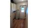 Mud room featuring vinyl floors, white cabinets, and access to the exterior at 418 Tivoli Park Dr, Davenport, FL 33897