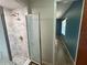 Bathroom features glass shower enclosure, gold colored hardware and tile surround at 4211 Sunny Land Dr, Lakeland, FL 33813