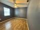 Bedroom with wood-look tile flooring, ceiling fan and one window at 4211 Sunny Land Dr, Lakeland, FL 33813