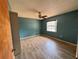 Bedroom with wood-look tile flooring, ceiling fan and one window at 4211 Sunny Land Dr, Lakeland, FL 33813