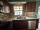 Updated kitchen featuring granite countertops, stainless steel appliances, and ample cabinet space at 4211 Sunny Land Dr, Lakeland, FL 33813