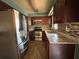 Updated kitchen features granite countertops, tile backsplash and stainless steel appliances at 4211 Sunny Land Dr, Lakeland, FL 33813