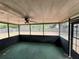 View of enclosed back porch area with full view of the backyard at 4211 Sunny Land Dr, Lakeland, FL 33813