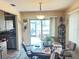 Bright breakfast nook featuring lots of natural light and a slider door to the backyard at 426 Gleneagles Ct, Winter Haven, FL 33884