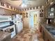 Functional kitchen with vintage accents, good cabinet space, and easy access to other rooms at 426 Gleneagles Ct, Winter Haven, FL 33884