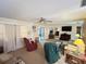 Large living room provides ample space, neutral tones, and access to backyard through slider at 426 Gleneagles Ct, Winter Haven, FL 33884