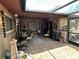 Covered outdoor patio with tiled flooring, decorated with outdoor furniture and decor at 426 Gleneagles Ct, Winter Haven, FL 33884