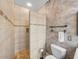 Bathroom showcasing a tiled walk-in shower and toilet at 4327 Gullane Dr, Lake Wales, FL 33859