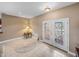 Bright foyer featuring tile flooring, a neutral color palette, and a decorative front door at 4327 Gullane Dr, Lake Wales, FL 33859
