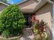 Inviting front entrance with colorful landscaping and a paved walkway to the front door at 4327 Gullane Dr, Lake Wales, FL 33859