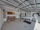 Spacious garage with cabinets, providing ample storage and workspace for various projects at 4327 Gullane Dr, Lake Wales, FL 33859