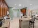 Kitchen with granite countertops, wood cabinets, stainless steel appliances and tile flooring at 4327 Gullane Dr, Lake Wales, FL 33859