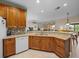 Well-appointed kitchen boasts granite countertops, and a spacious sink, seamlessly connecting to the living area at 4327 Gullane Dr, Lake Wales, FL 33859