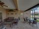 Enclosed lanai featuring neutral finishes, outdoor furniture, and access to backyard at 4327 Gullane Dr, Lake Wales, FL 33859