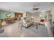 Open-concept living area with tile floors, seamlessly connecting living room, kitchen, and dining at 4327 Gullane Dr, Lake Wales, FL 33859