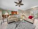 Bright, open living space boasts tile floors connecting the living room to the kitchen and dining areas at 4327 Gullane Dr, Lake Wales, FL 33859