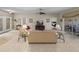 Bright living room showcasing tile floors and seamless access to the screened-in patio at 4327 Gullane Dr, Lake Wales, FL 33859